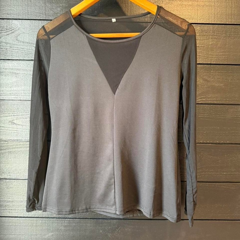Sleek black long sleeve top with mesh shoulder and sleeve detailing